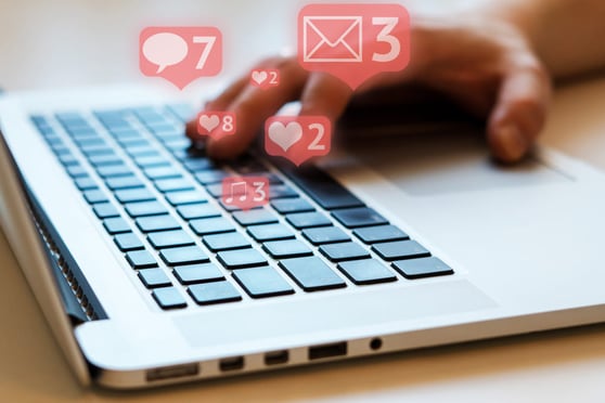 Man is using laptop with black keys, Social media and social networking.